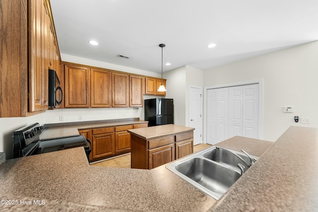 1012 Lake Norman Ln, Leland, NC 28451 - kitchen featuring a sink, visible vents, recessed lighting, brown cabinetry, and black appliances