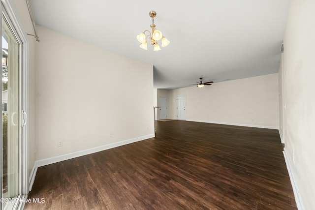 1012 Lake Norman Ln, Leland, NC 28451 - empty room with dark wood finished floors, baseboards, and ceiling fan with notable chandelier