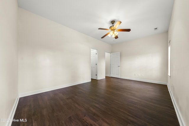 1012 Lake Norman Ln, Leland, NC 28451 - spare room featuring baseboards, a ceiling fan, dark wood-type flooring, and visible vents