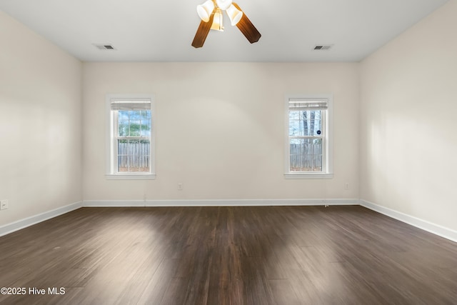 1012 Lake Norman Ln, Leland, NC 28451 - unfurnished room with dark wood-style floors, baseboards, ceiling fan, and visible vents