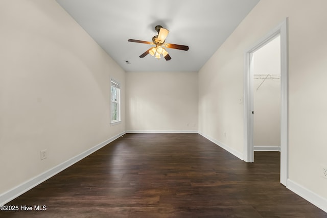1012 Lake Norman Ln, Leland, NC 28451 - empty room featuring dark wood finished floors, baseboards, and a ceiling fan