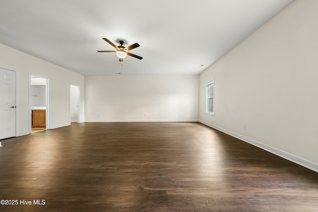 1012 Lake Norman Ln, Leland, NC 28451 - unfurnished living room featuring dark wood-style flooring, baseboards, and ceiling fan