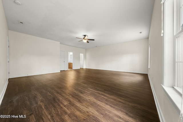 1012 Lake Norman Ln, Leland, NC 28451 - unfurnished room featuring dark wood finished floors, baseboards, a ceiling fan, and visible vents