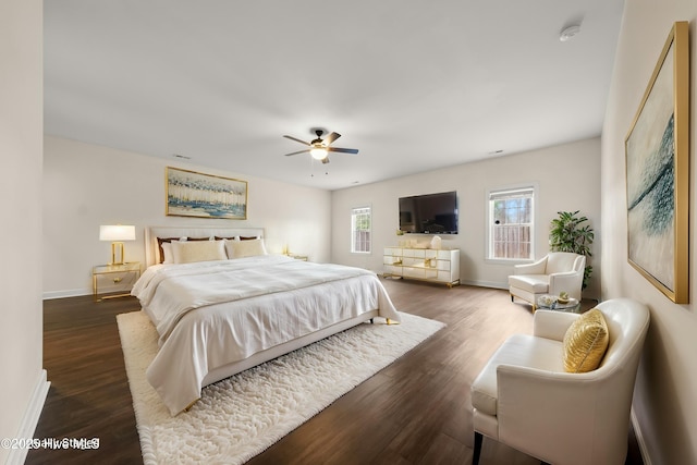 1012 Lake Norman Ln, Leland, NC 28451 - bedroom featuring dark wood-type flooring, a ceiling fan, and baseboards