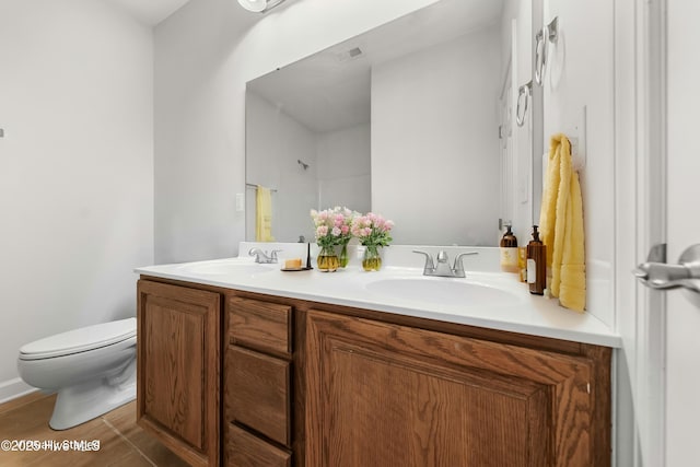 1012 Lake Norman Ln, Leland, NC 28451 - bathroom featuring a shower, toilet, a sink, and double vanity