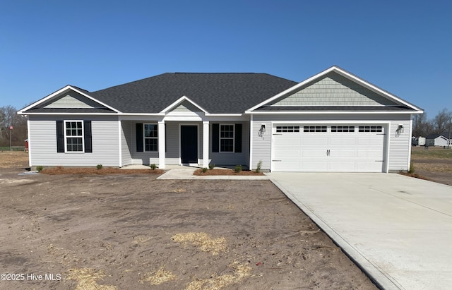 view of front of home featuring an attached garage and concrete driveway