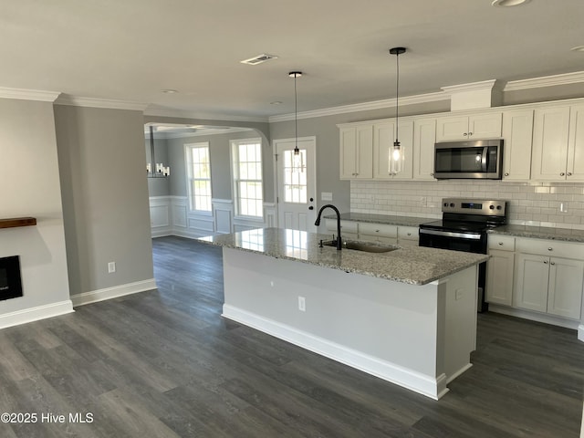 kitchen featuring dark wood-style floors, white cabinetry, stainless steel appliances, and a sink