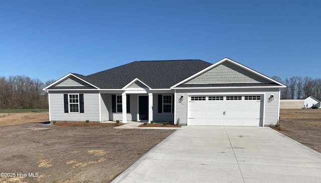 view of front facade featuring concrete driveway and an attached garage