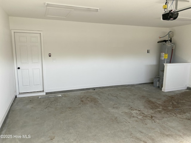 garage featuring baseboards, a garage door opener, and water heater