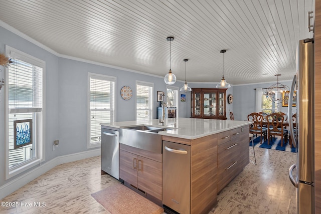 kitchen with stainless steel appliances, a healthy amount of sunlight, and crown molding