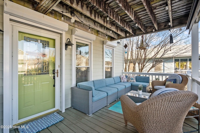 wooden deck featuring an outdoor hangout area