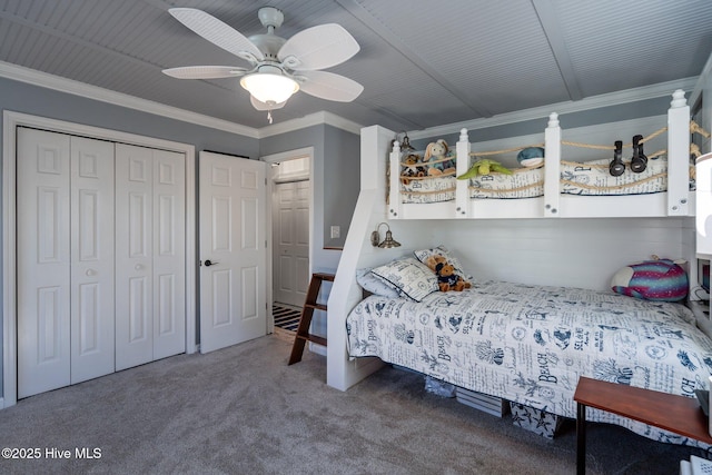 bedroom featuring a closet, carpet, ornamental molding, and a ceiling fan