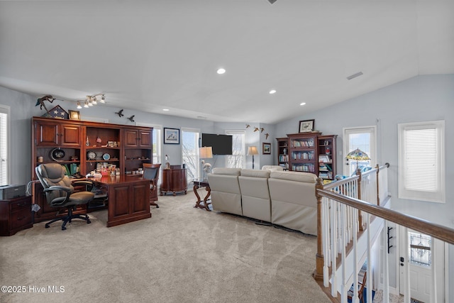 living room with lofted ceiling, recessed lighting, visible vents, and light carpet