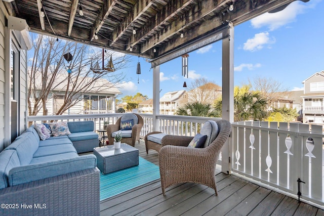 wooden terrace featuring a residential view and an outdoor hangout area