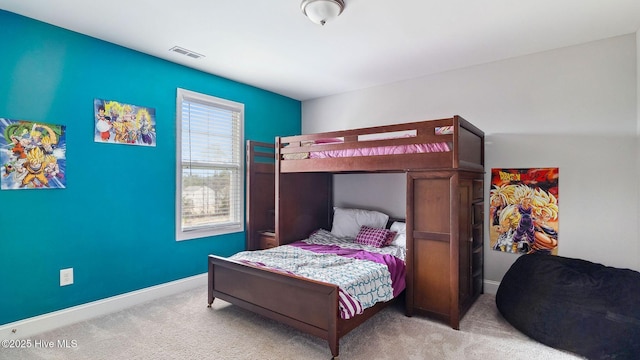 carpeted bedroom with baseboards and visible vents