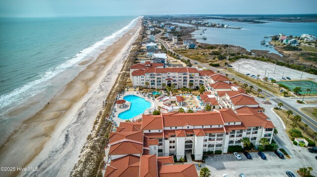 aerial view featuring a view of the beach and a water view