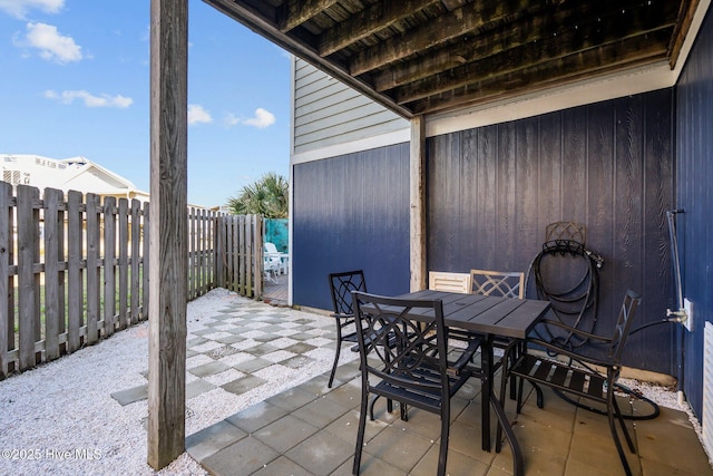 view of patio / terrace featuring outdoor dining space and a fenced backyard