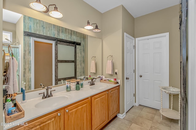 full bathroom featuring tile patterned flooring, double vanity, and a sink