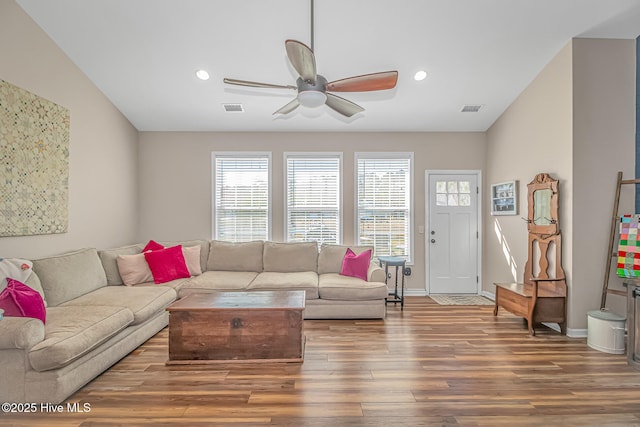 living room with visible vents, recessed lighting, a ceiling fan, and wood finished floors