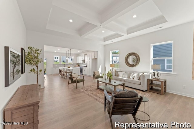 living room with visible vents, beamed ceiling, recessed lighting, light wood-style floors, and coffered ceiling