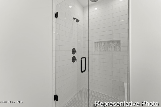 bathroom featuring a stall shower