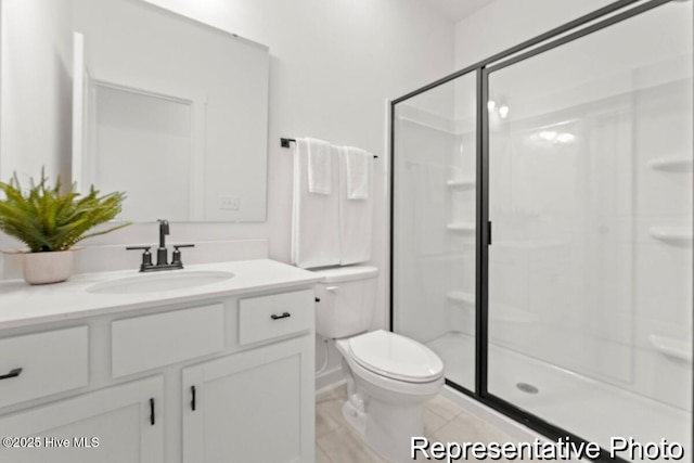 full bath with toilet, a stall shower, vanity, and tile patterned flooring