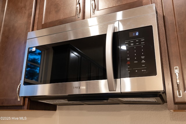 interior details featuring stainless steel microwave