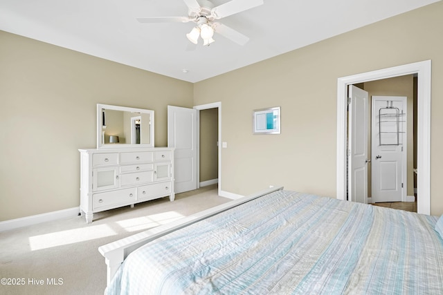 bedroom with light colored carpet, baseboards, and ceiling fan