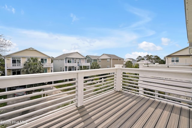 wooden terrace featuring a residential view