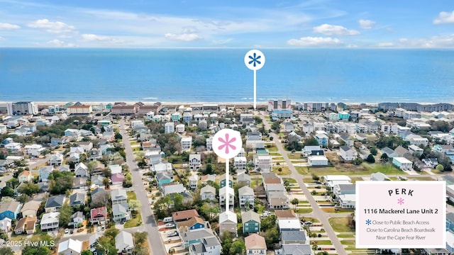 birds eye view of property with a residential view and a water view