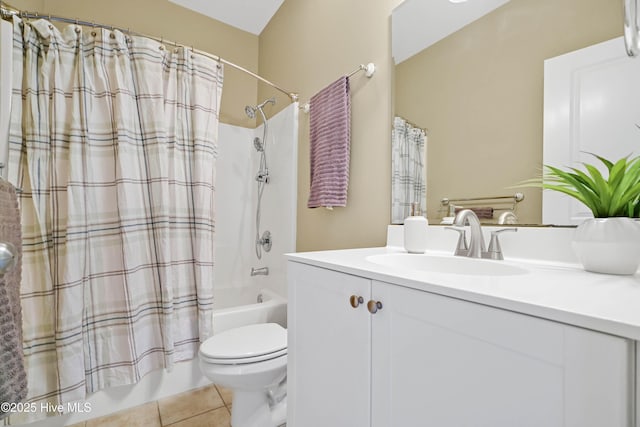 bathroom with tile patterned flooring, toilet, vanity, and shower / bath combo