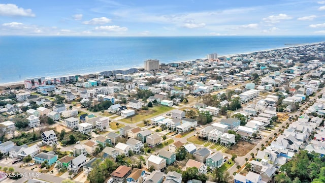 drone / aerial view with a residential view and a water view