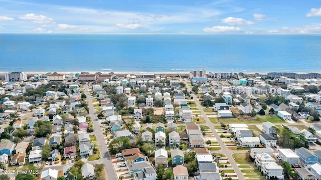 drone / aerial view featuring a residential view and a water view