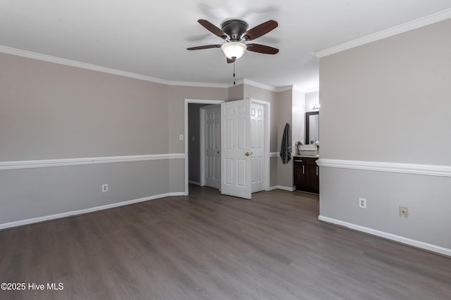 unfurnished bedroom with ceiling fan, wood finished floors, baseboards, and ornamental molding