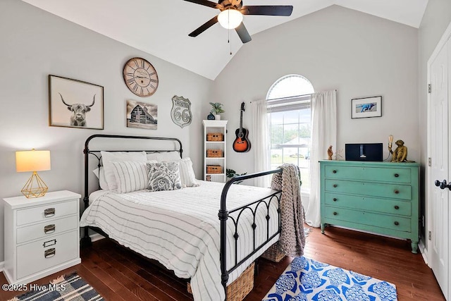 bedroom featuring lofted ceiling, a ceiling fan, and dark wood-style flooring