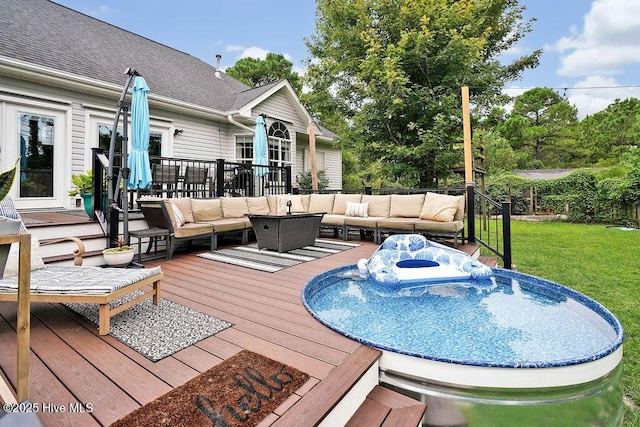 view of swimming pool featuring an outdoor living space, a lawn, and a wooden deck