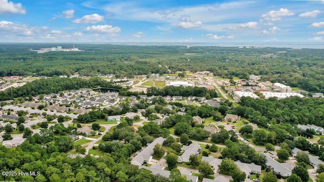 birds eye view of property with a residential view and a wooded view