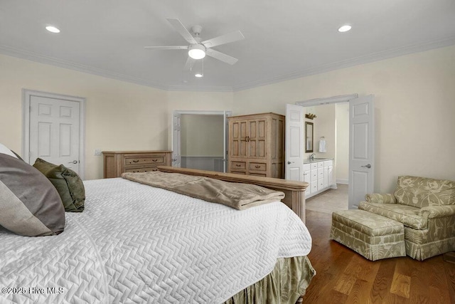 bedroom with a ceiling fan, wood finished floors, recessed lighting, a sink, and ornamental molding