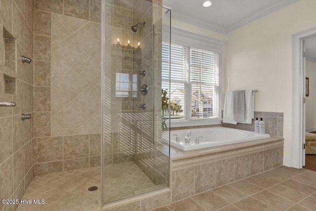 bathroom with tile patterned flooring, a stall shower, crown molding, and a garden tub