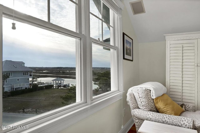 sitting room featuring lofted ceiling