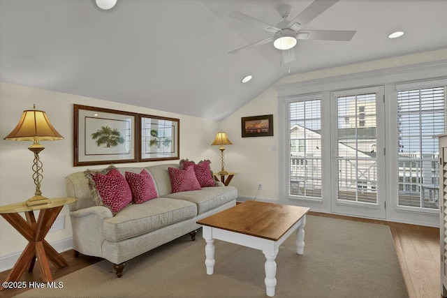 living room with a ceiling fan, wood finished floors, baseboards, lofted ceiling, and recessed lighting