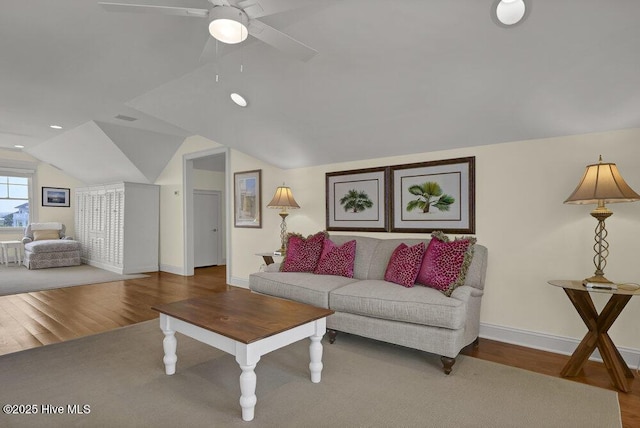 living area with a ceiling fan, wood finished floors, recessed lighting, baseboards, and vaulted ceiling