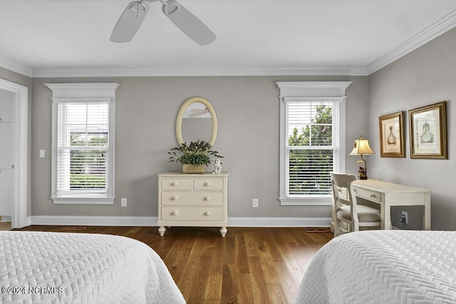 bedroom featuring baseboards, multiple windows, dark wood-style flooring, and crown molding