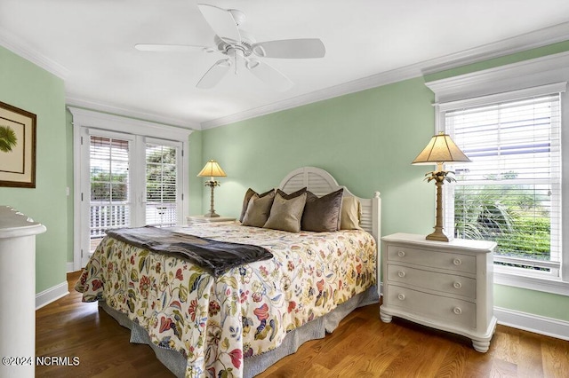 bedroom with baseboards, wood finished floors, access to exterior, and crown molding