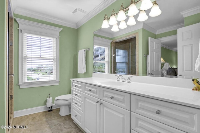 bathroom with visible vents, vanity, crown molding, and baseboards