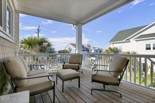 wooden terrace with a residential view