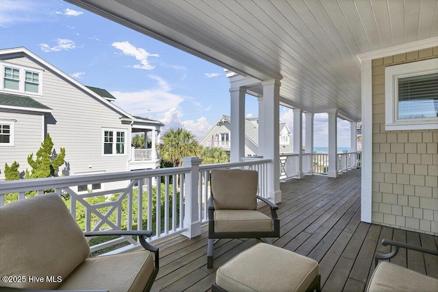 wooden deck with a residential view