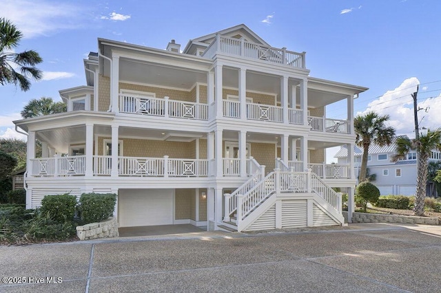 coastal home featuring an attached garage