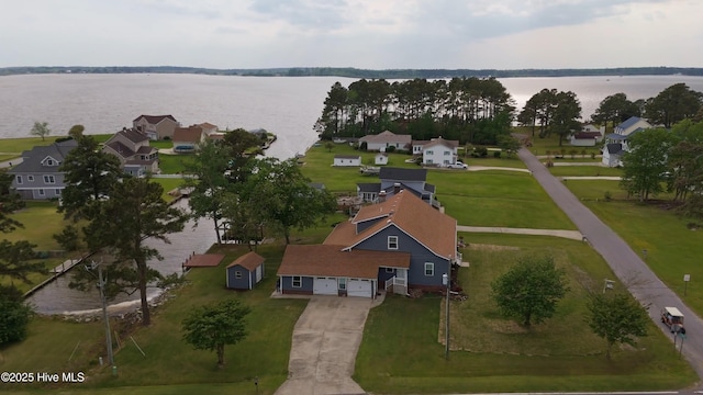 bird's eye view featuring a water view and a residential view