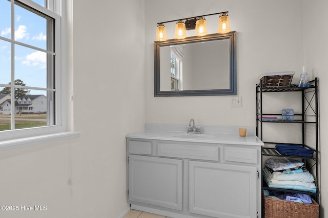 bathroom with vanity and plenty of natural light